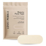 A beige stand-up pouch labeled LOVE PEBBLE Beauty Face Tape, shown with one pre-cut rectangular face tape strip in front on a white background.
