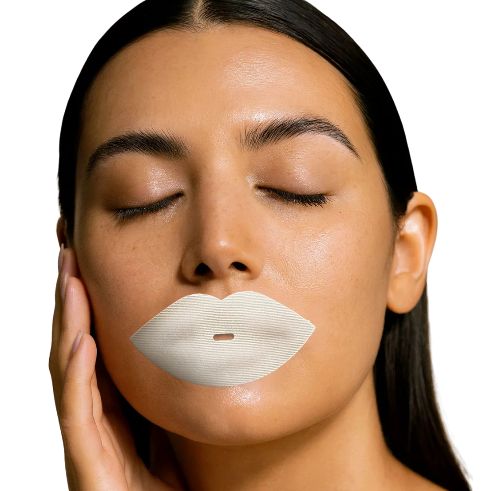 A close-up of a woman's face with a white, lip-shaped patch applied to her mouth area, shown against a plain white background.