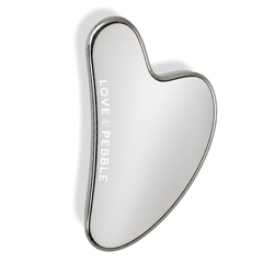 A heart-shaped hand mirror with a polished silver metal frame and a reflective silver mirror surface, featuring the brand name 'LOVE & PEBBLE' vertically printed on the left side, set against a plain white background.
