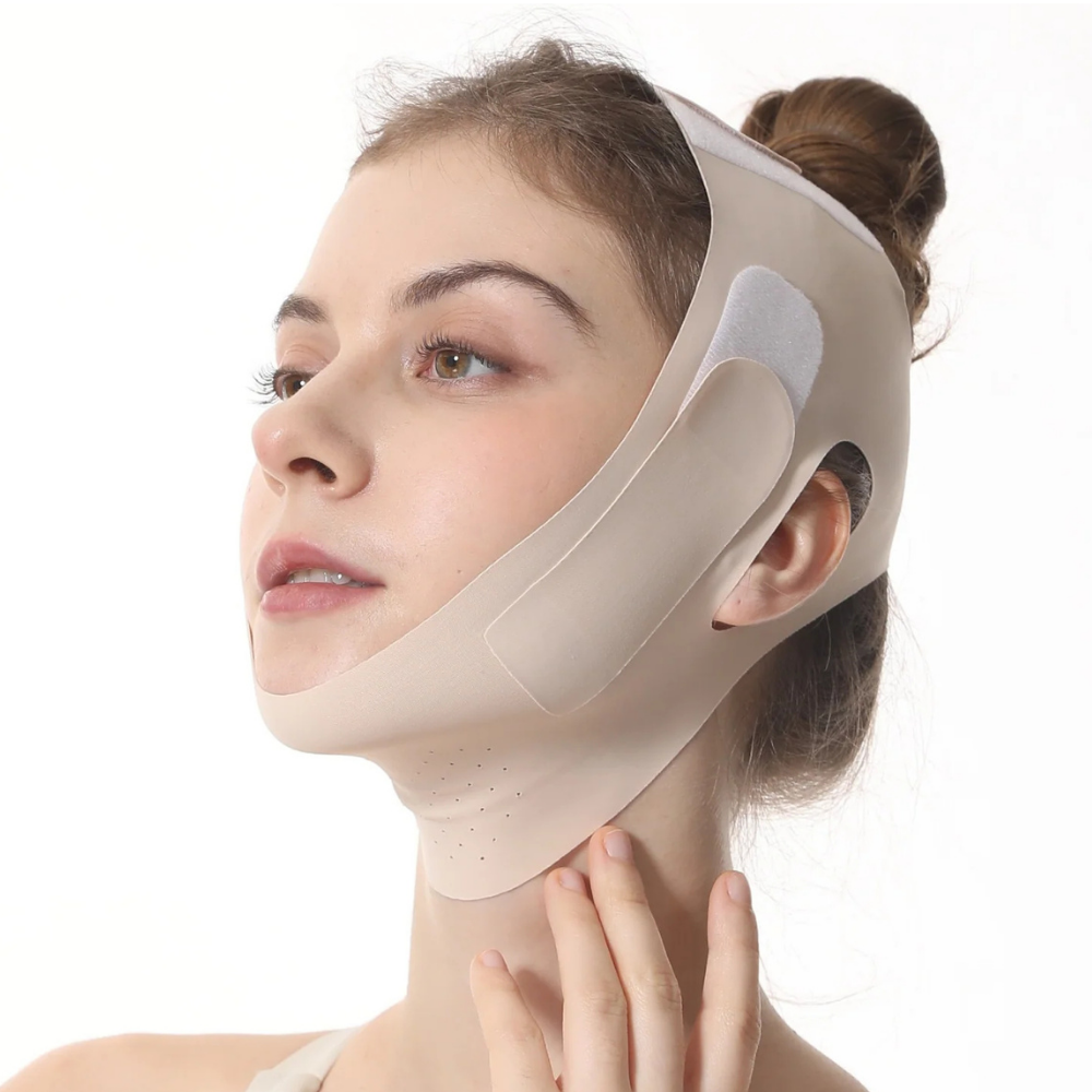 A woman wearing a beige chin and jawline support brace against a plain white background.