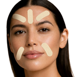 Close-up of a woman's face with five beige adhesive patch strips applied on her forehead, cheeks, and chin against a plain white background.