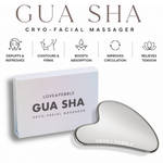 Heart-shaped gua sha cryo-facial massager with a silver metallic finish, shown next to its white packaging box. The image includes feature icons and text describing the benefits of the gua sha massage.